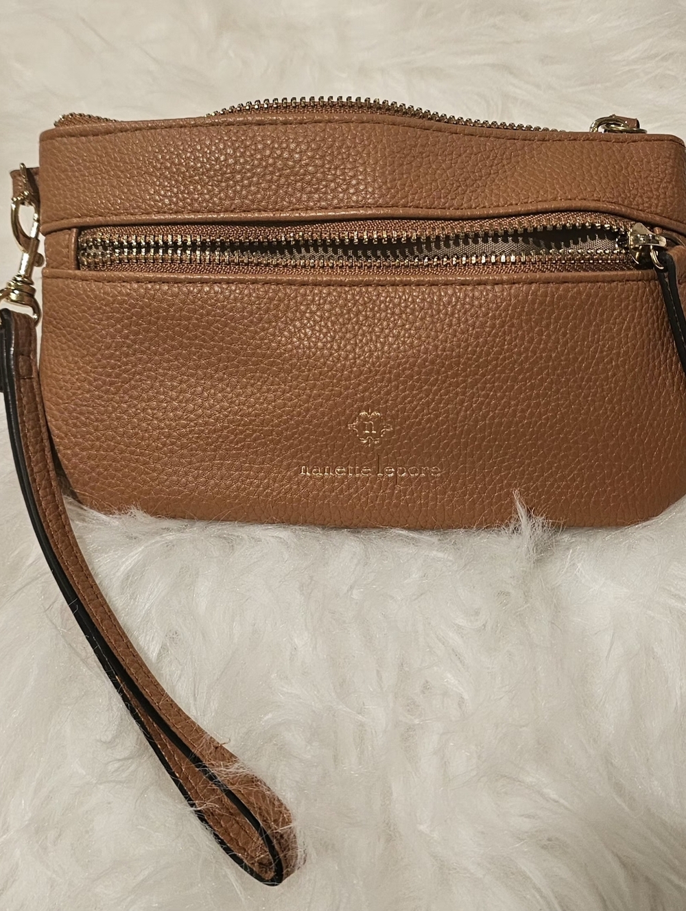 Nanette Lepore tan pebbled wristlet with gold hardware